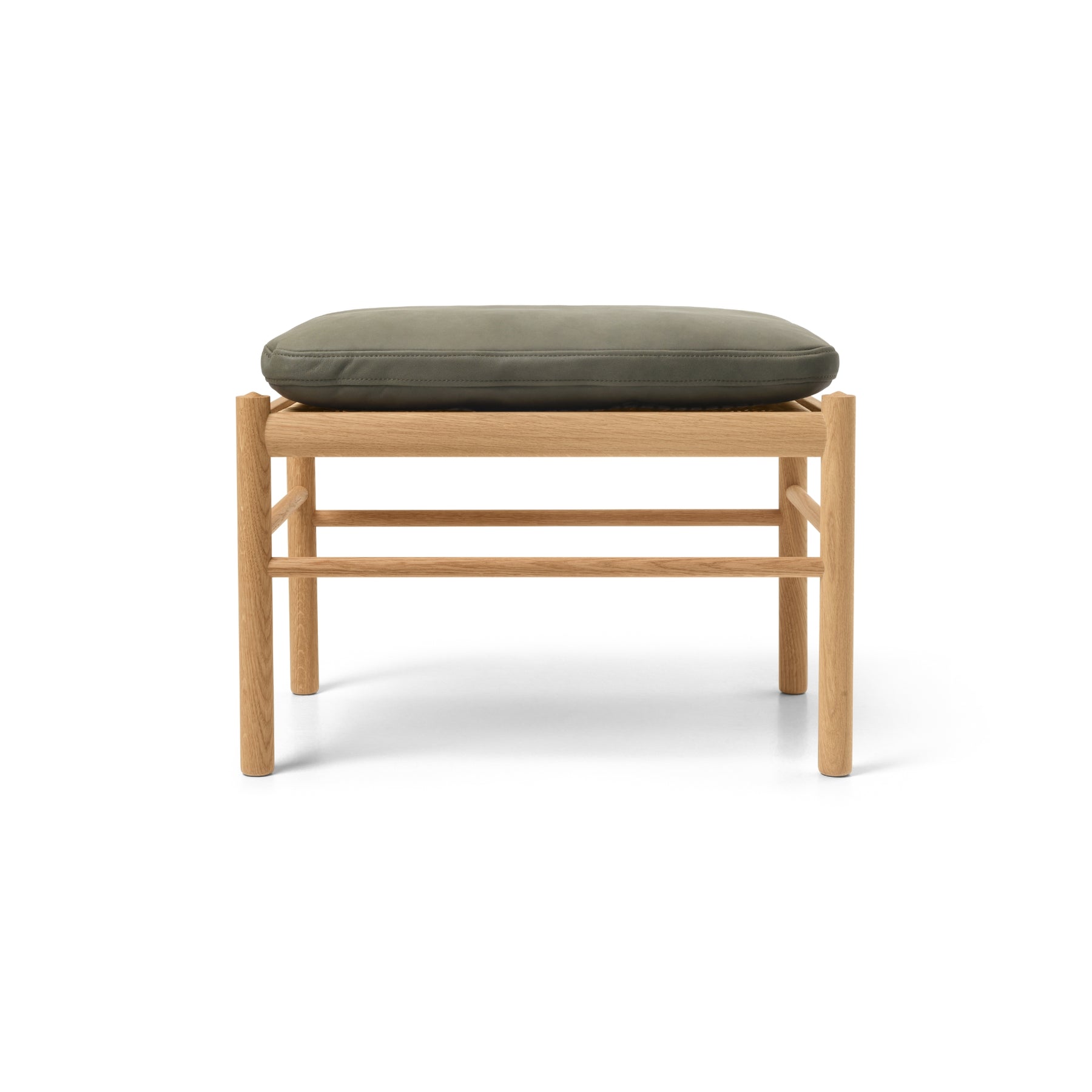Wooden stool with a green cushion