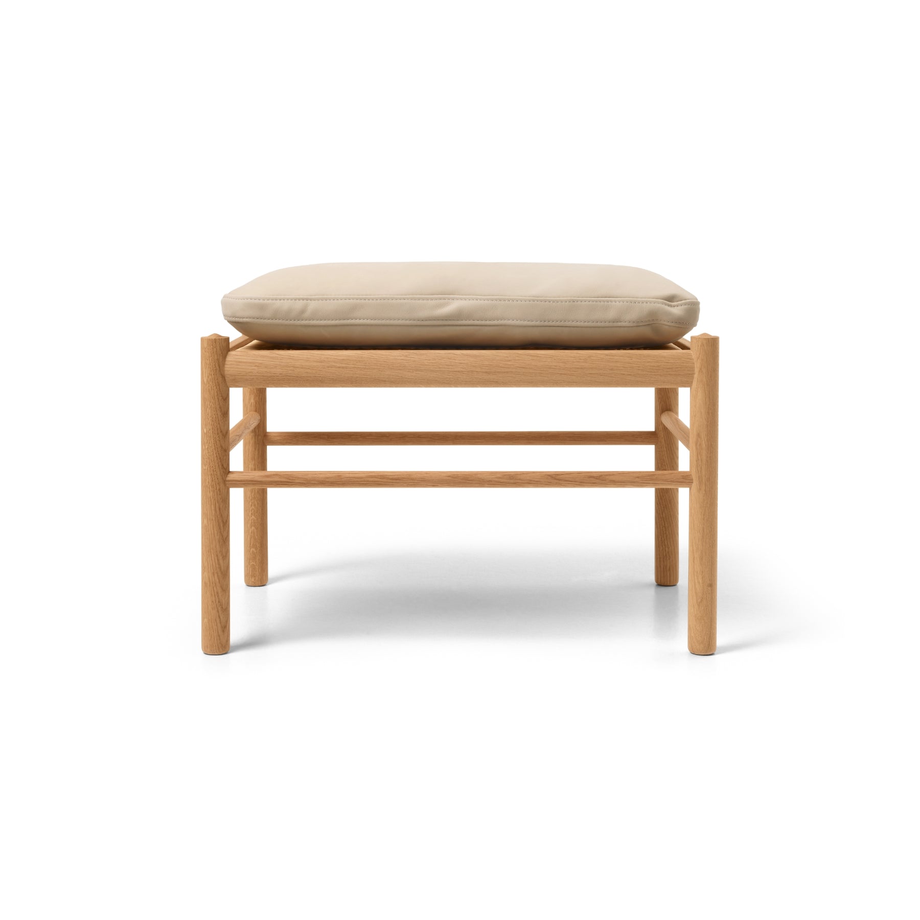 Wooden stool with a beige cushion