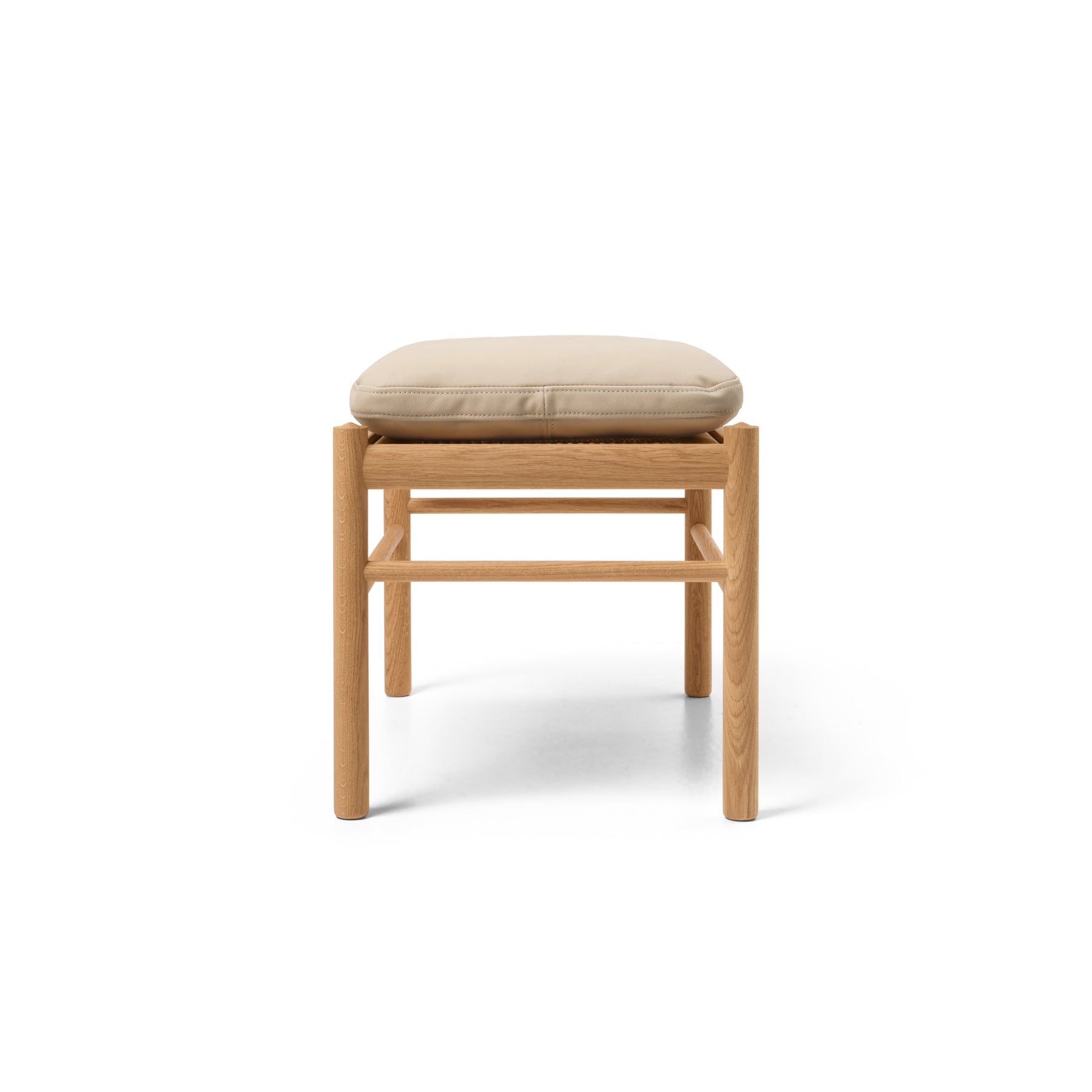 Wood stool with beige leather cushion