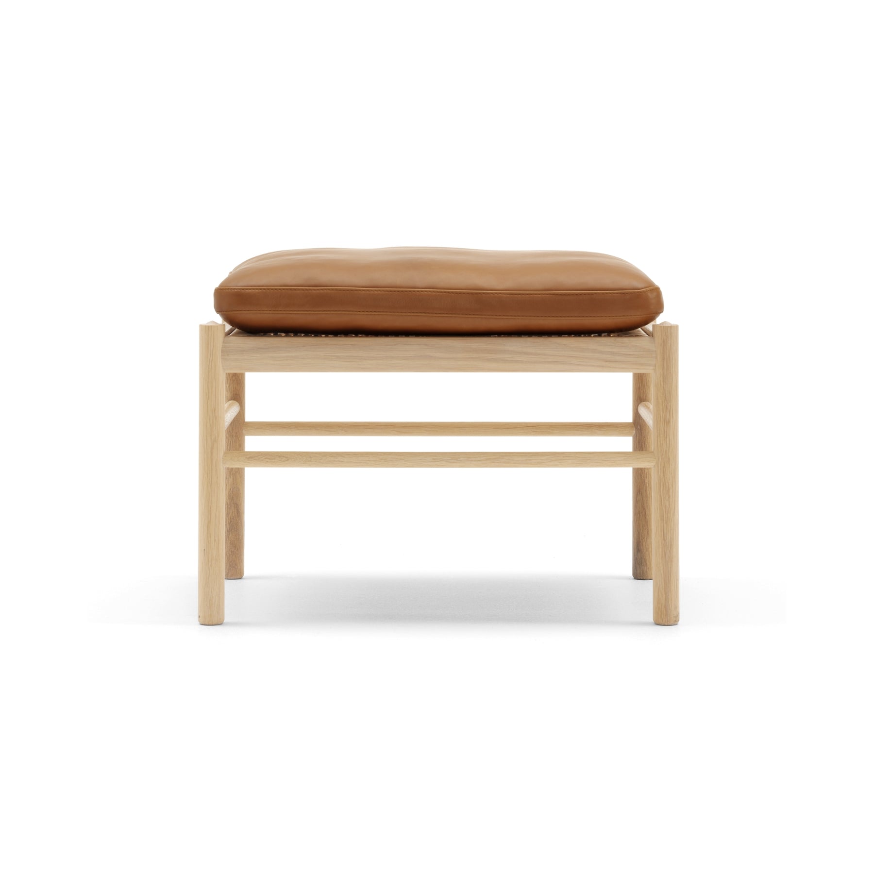 Wooden stool with a brown cushion