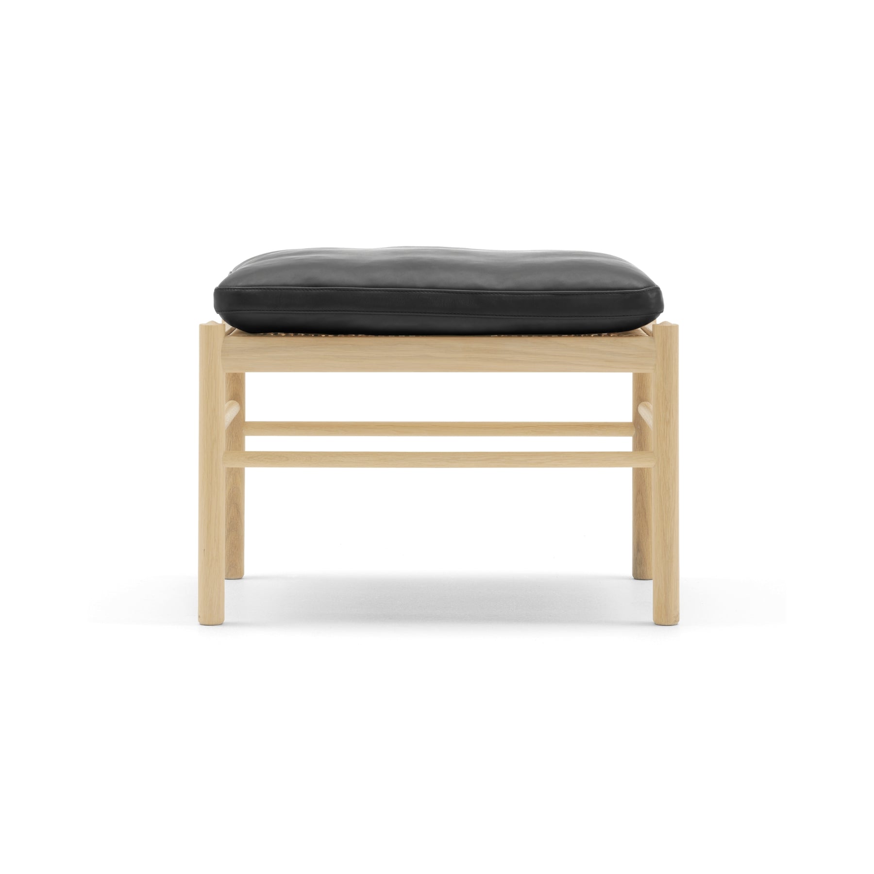 Wooden stool with a black cushion