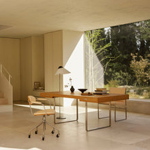 Modern office with wooden desk, chairs