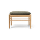 Wooden stool with a green cushion 