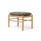 Wooden stool with green cushion