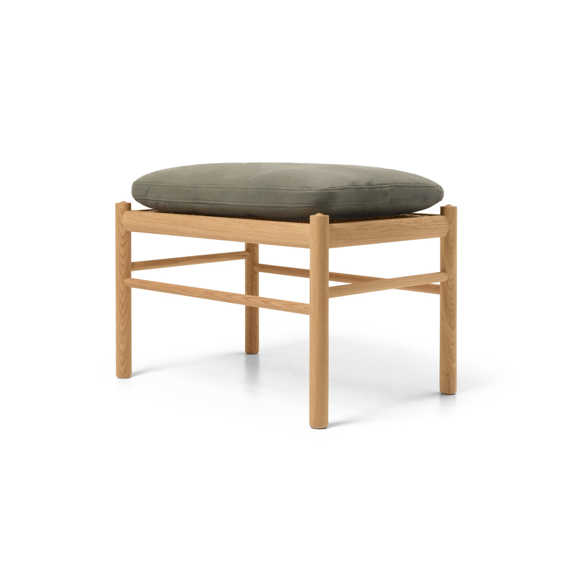 Wooden stool with green cushion