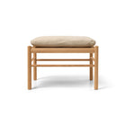 Wooden stool with a beige cushion 