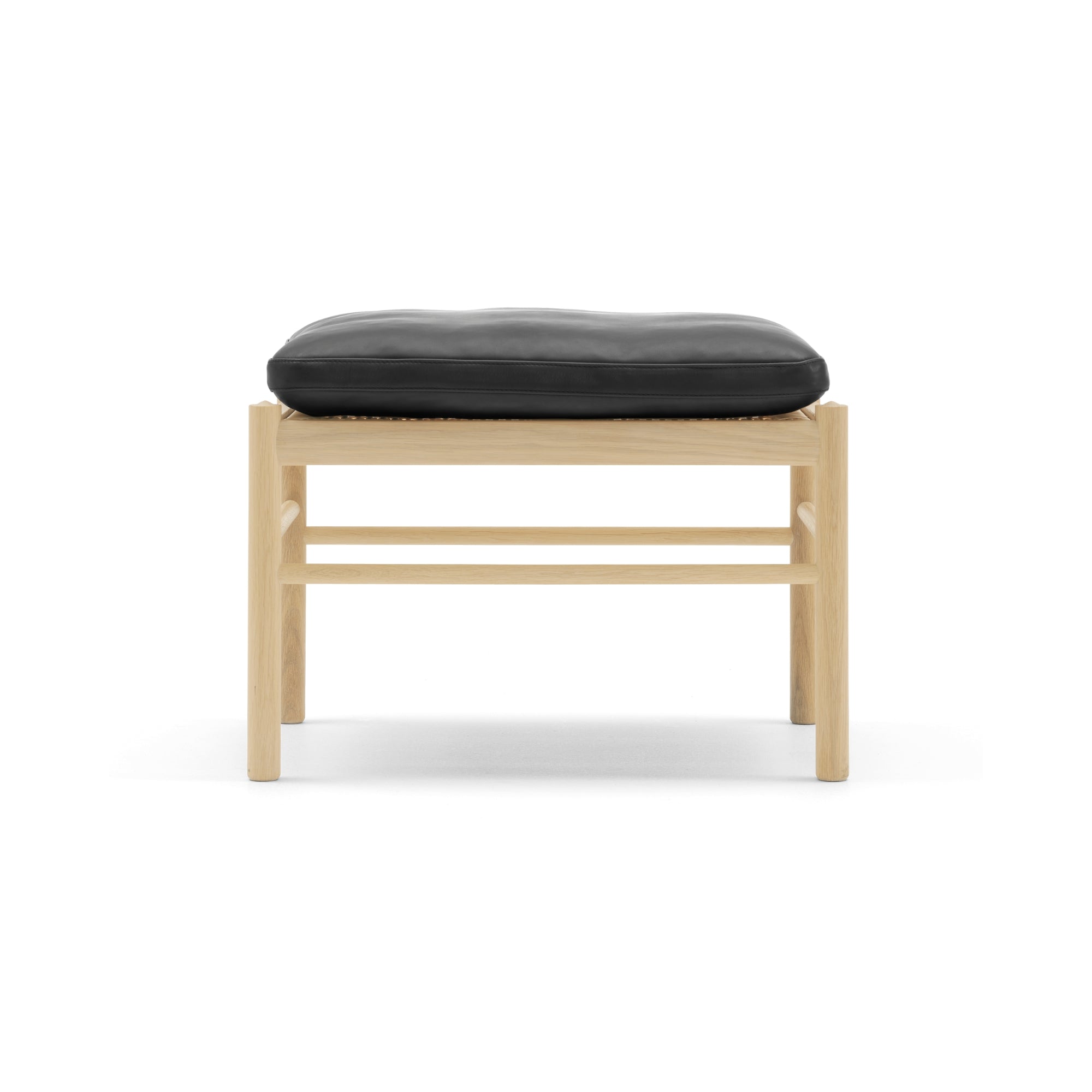 Wooden stool with a black cushion