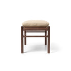 Wooden stool with beige pillow