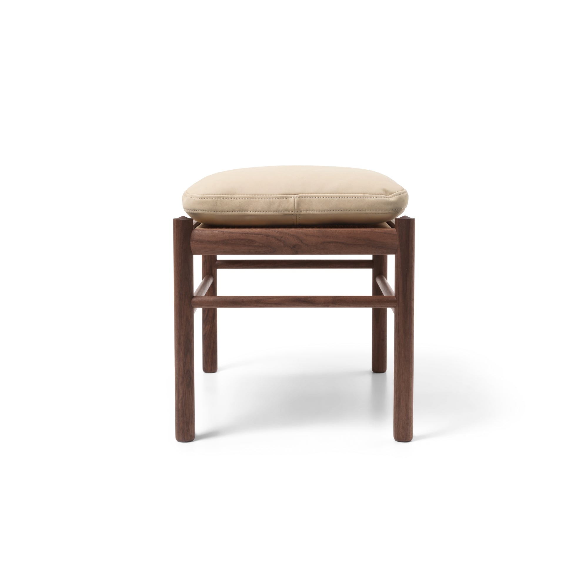 Wooden stool with beige pillow