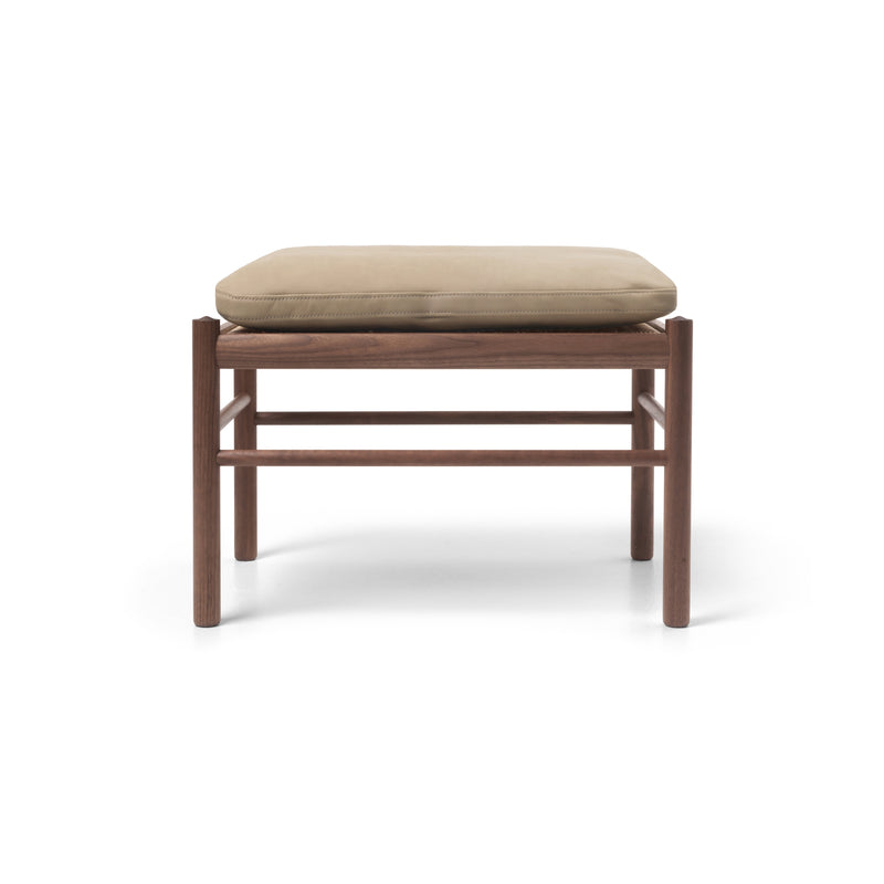 Wooden stool with beige pillow