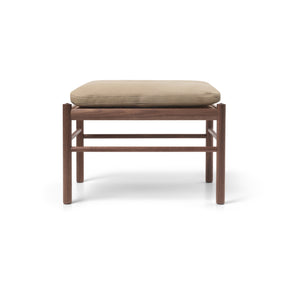 Wooden stool with beige pillow