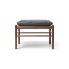 Wooden stool with a gray cushion