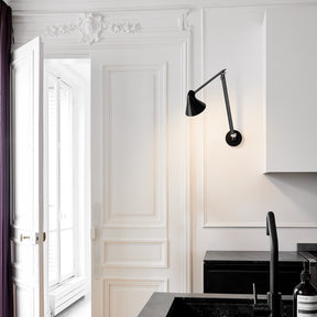 NJP wall lamp with long arm and black wall plate by Louis Poulsen, stylish wall light with adjustable arm and sleek design for modern interiors